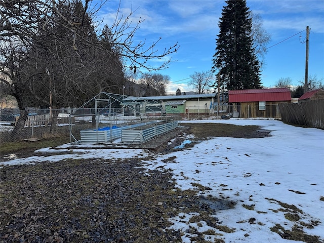 exterior space with a garden and fence