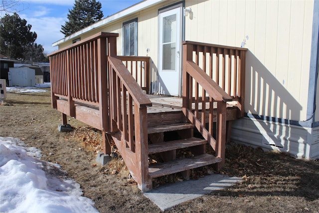 wooden terrace featuring stairway