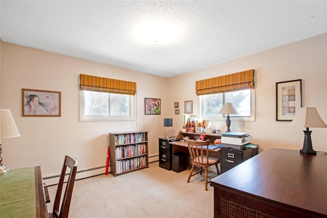 office area featuring a baseboard heating unit, light carpet, and a textured ceiling