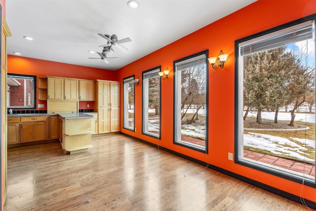 kitchen featuring dark countertops, ceiling fan, light wood-type flooring, open shelves, and recessed lighting