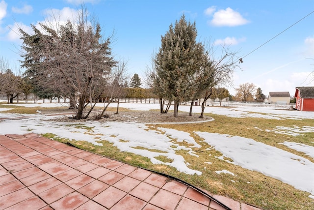 view of yard layered in snow