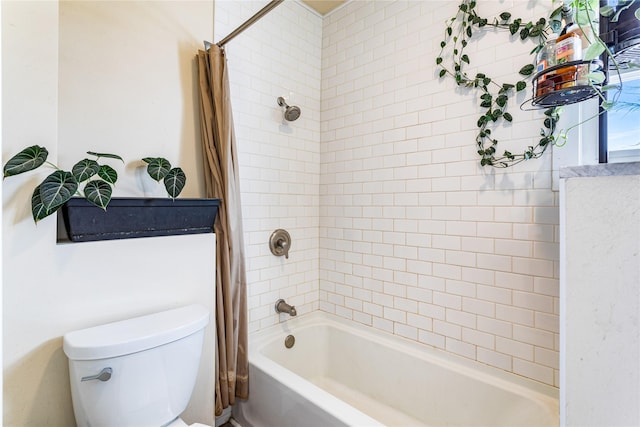 full bathroom featuring shower / bath combo and toilet