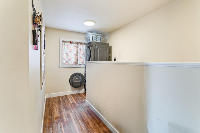 hall featuring wood finished floors and baseboards