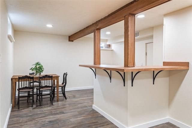 dining area featuring recessed lighting, dark wood-style flooring, visible vents, baseboards, and beamed ceiling