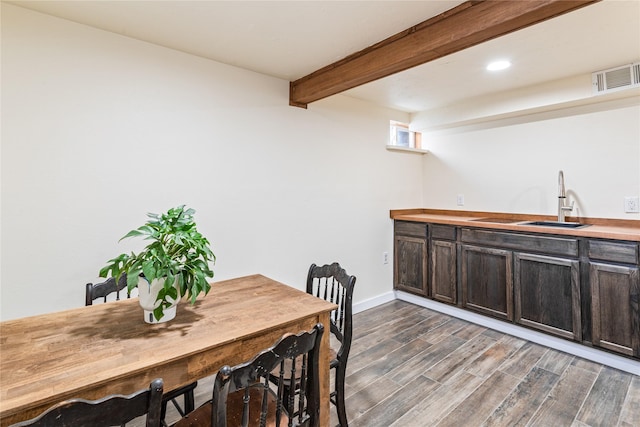 dining area featuring baseboards, visible vents, dark wood-style floors, beam ceiling, and recessed lighting