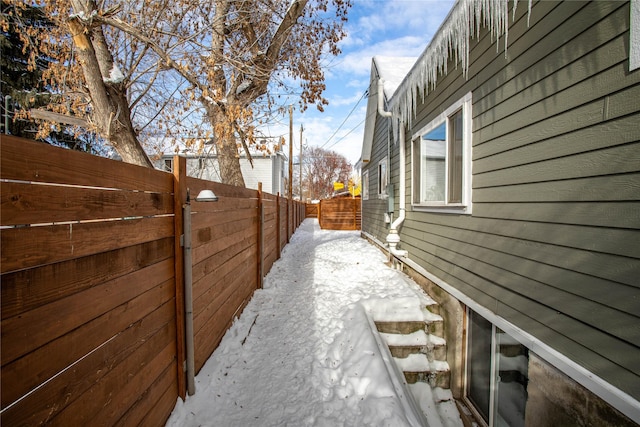 view of side of home with fence private yard