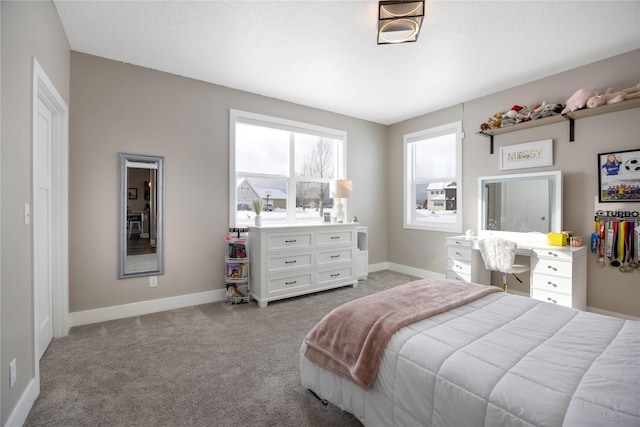 carpeted bedroom with baseboards