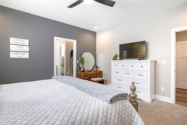 bedroom with a ceiling fan, carpet, and baseboards