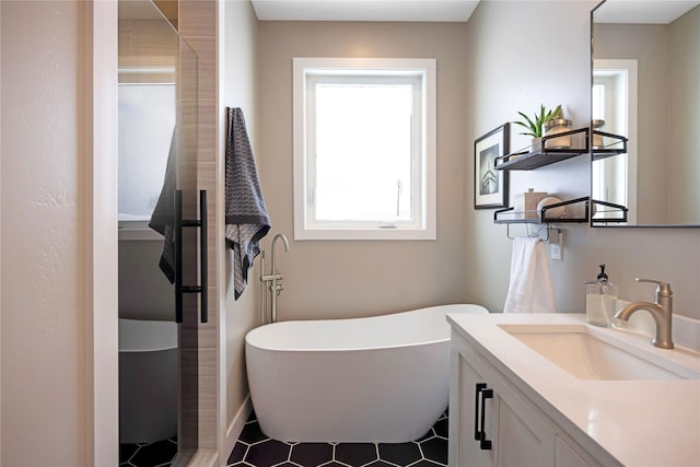 bathroom featuring a soaking tub, a shower stall, and vanity