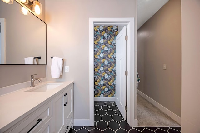 bathroom with vanity and baseboards