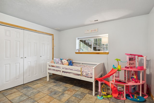 1743 Nighthawk Trl, Victor, MT 59875 - bedroom featuring stone finish flooring and a closet