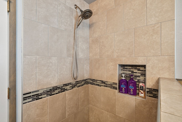 details with a tile shower