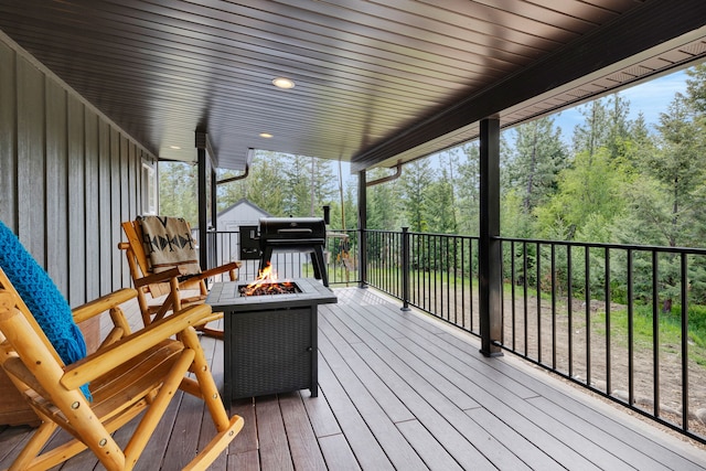 1743 Nighthawk Trl, Victor, MT 59875 - wooden deck with a fire pit