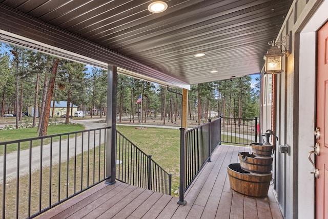 1743 Nighthawk Trl, Victor, MT 59875 - wooden porch featuring a yard