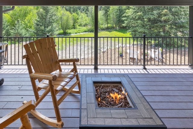 1743 Nighthawk Trl, Victor, MT 59875 - wooden deck featuring an outdoor fire pit