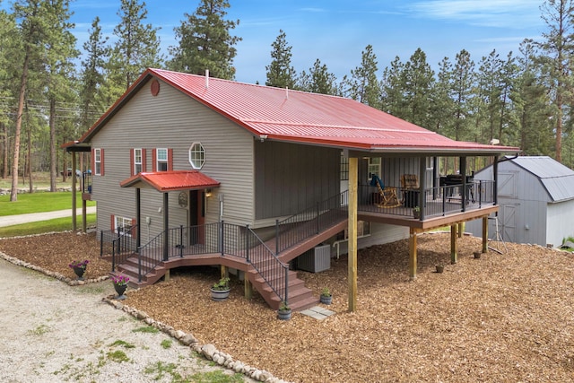 1743 Nighthawk Trl, Victor, MT 59875 - view of front of house with metal roof and central AC