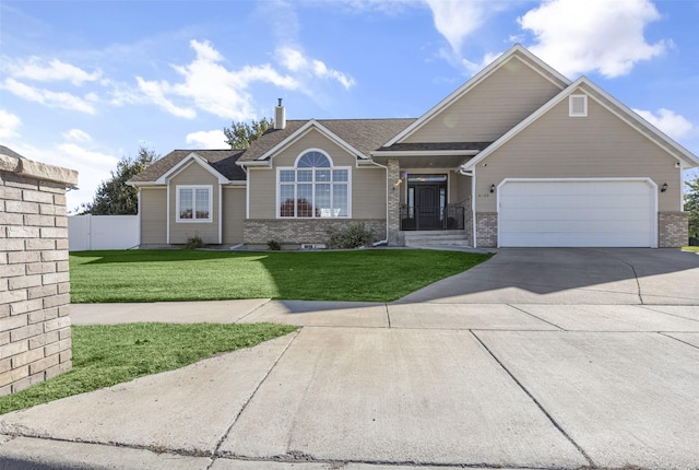 view of front of house with a garage, brick siding, fence, concrete driveway, and a front lawn