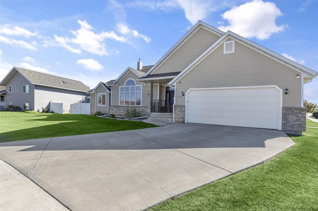 craftsman house with a front yard, concrete driveway, brick siding, and an attached garage