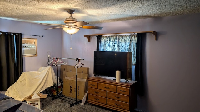 403 Dakota Ave, Libby, MT 59923 - bedroom featuring a textured ceiling, carpet, and ceiling fan