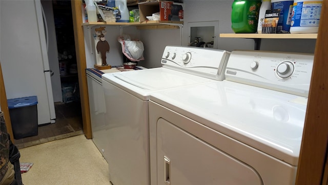 403 Dakota Ave, Libby, MT 59923 - washroom with washing machine and clothes dryer and light carpet