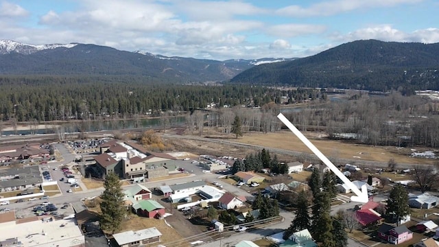 403 Dakota Ave, Libby, MT 59923 - aerial view of a mountain backdrop and a heavily wooded area