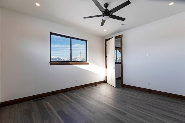 unfurnished room with recessed lighting, baseboards, and wood finished floors