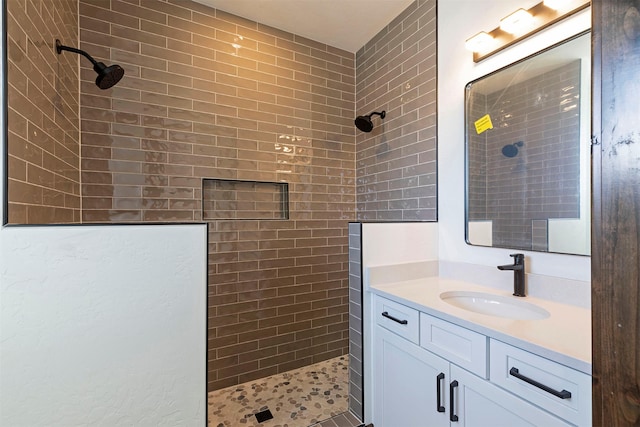 full bathroom featuring vanity and walk in shower