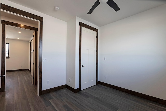 unfurnished bedroom with recessed lighting, dark wood finished floors, a ceiling fan, and baseboards