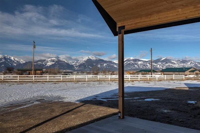 view of yard with a mountain view and fence