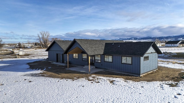 view of front of house with a shingled roof