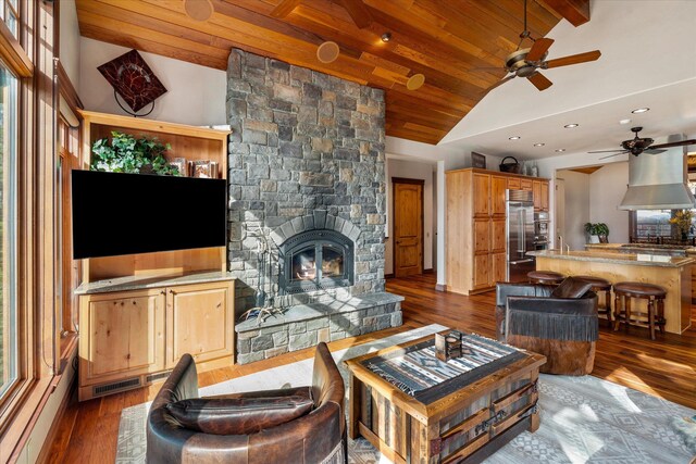 living area featuring visible vents, lofted ceiling, dark wood-style floors, wood ceiling, and a fireplace