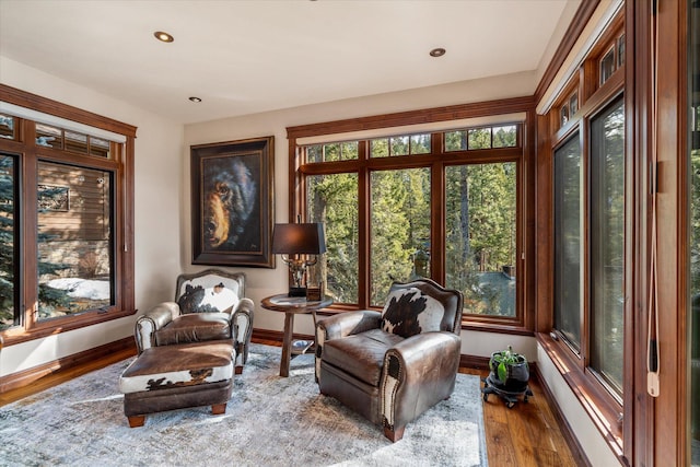 interior space with recessed lighting, baseboards, and wood finished floors