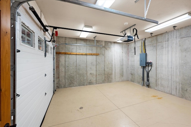 basement featuring a garage and electric panel