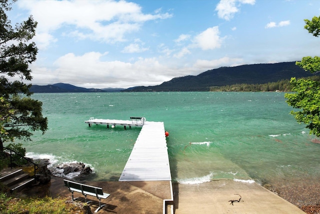 dock area with a water and mountain view