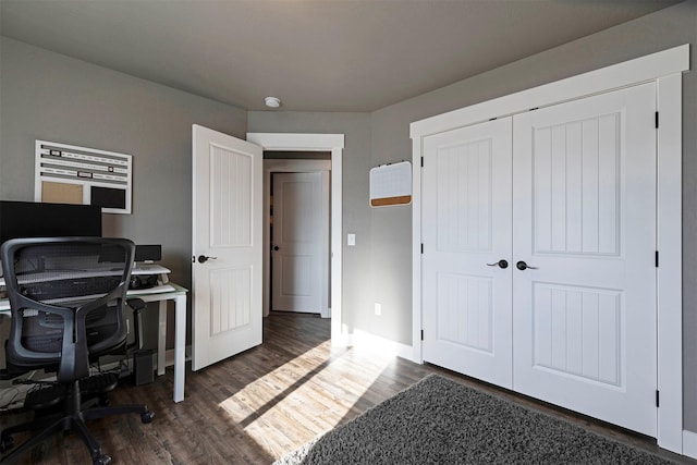 office space featuring dark wood-style floors and baseboards