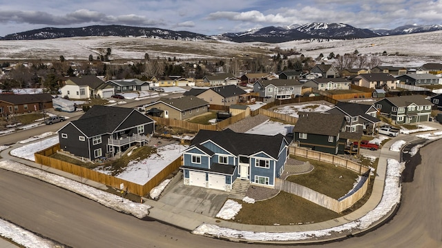 drone / aerial view with a residential view and a mountain view