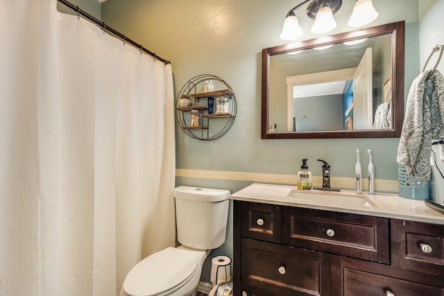 full bath featuring toilet and vanity