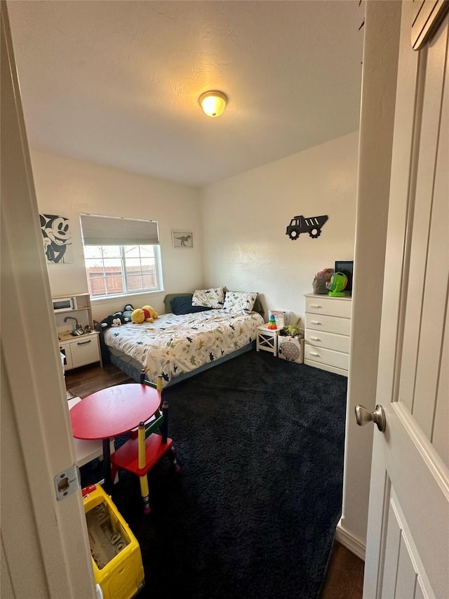 bedroom with wood finished floors