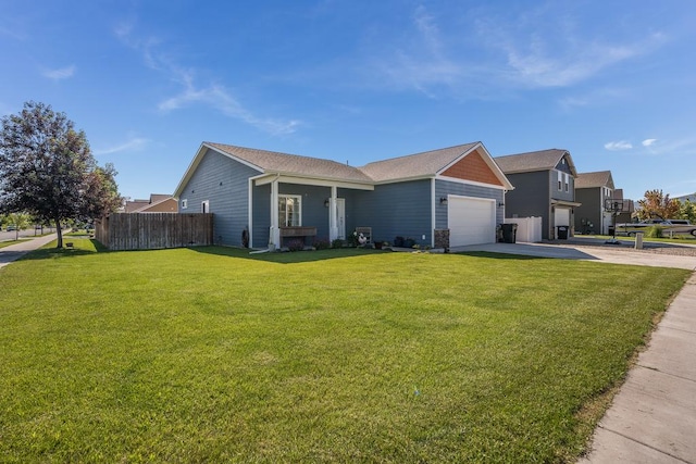 view of front of house featuring a garage, fence, concrete driveway, and a front yard