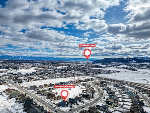 birds eye view of property with a mountain view