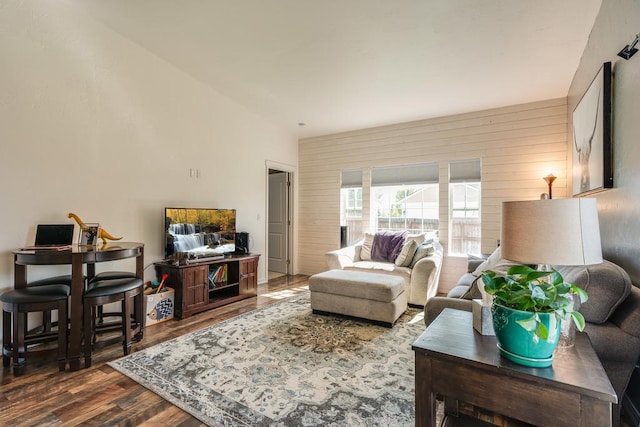 living room featuring wood walls and wood finished floors