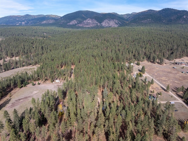 aerial view featuring a mountain view and a forest view