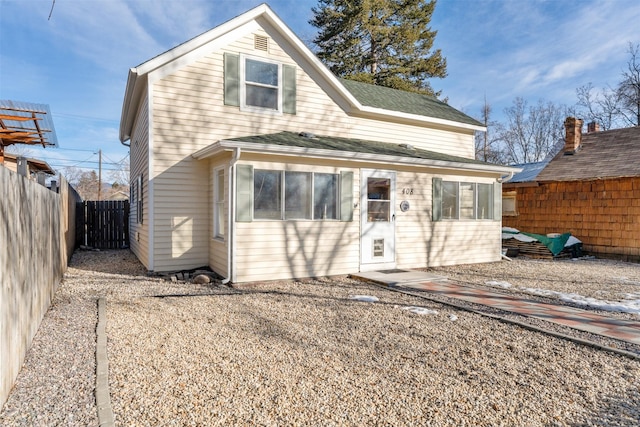 back of property with fence