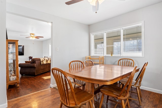 dining area with ceiling fan, wood finished floors, and baseboards