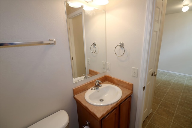 half bath with vanity and toilet