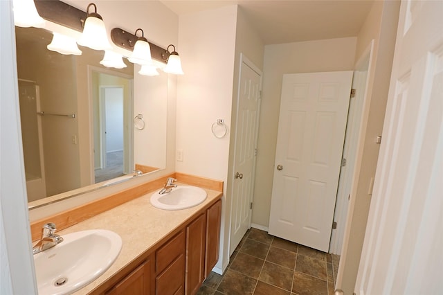 bathroom featuring double vanity and a sink