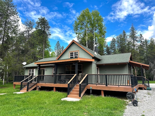 22 Pinewoods Dr, Trout Creek, MT 59874 - view of front of home featuring a front yard and a wooden deck