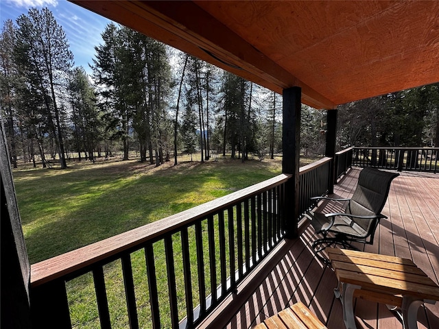 22 Pinewoods Dr, Trout Creek, MT 59874 - wooden terrace with a lawn and view of scattered trees