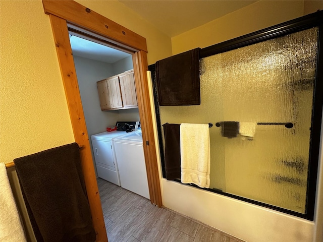 bathroom featuring independent washer and dryer and wood finished floors