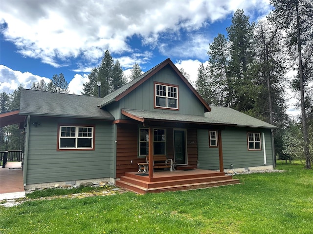 22 Pinewoods Dr, Trout Creek, MT 59874 - rear view of property with a porch, a lawn, and a shingled roof
